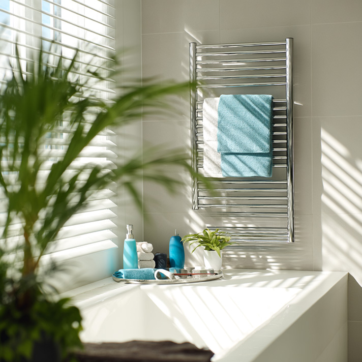 Designer towel rail radiator in a modern en-suite shower room